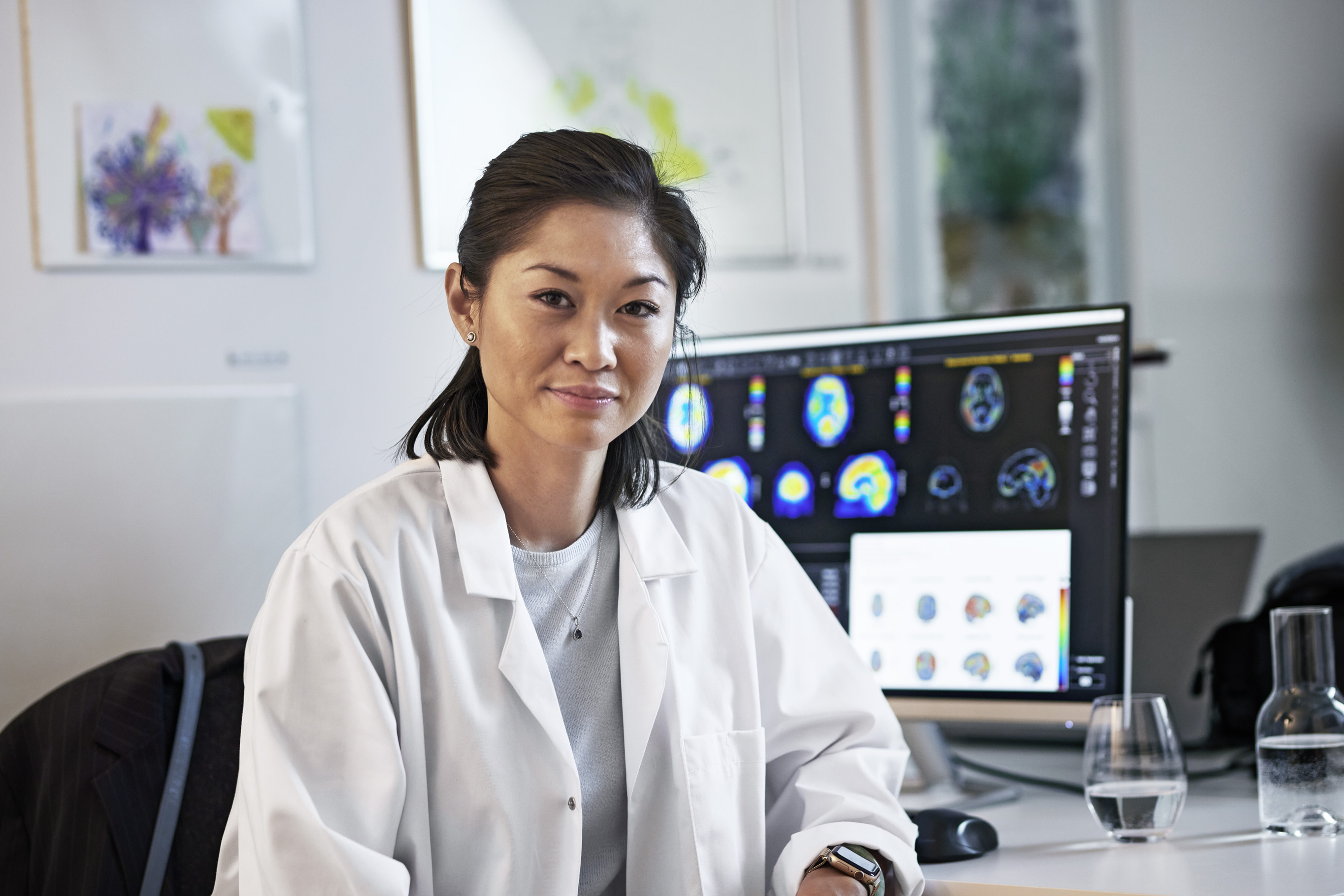 Female doctor working with nuclear medicine/molecular imaging brain scans